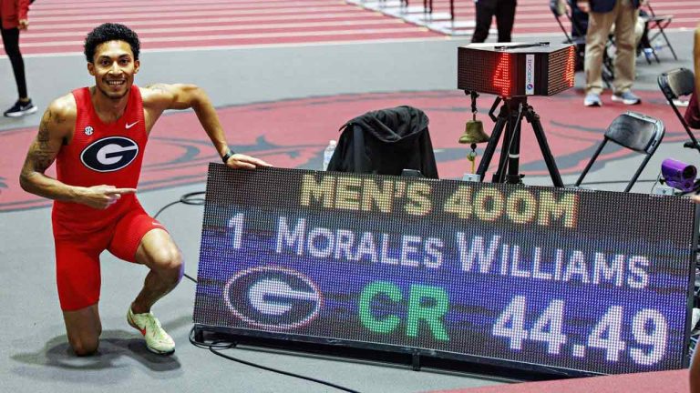 Canadian Christopher Morales Williams set a world indoor record in the men's 400 metres with a time of 44.49 seconds to win the NCAA Southeastern Conference indoor championships. Morales Williams, of Vaughan, Ont., poses for a photo next to his result during the NCAA Southeastern Conference indoor championships, in Fayetteville, Ark., in a Sunday, Feb. 25, 2024, handout photo. THE CANADIAN PRESS/HO-University of Georgia, Wesley Hitt