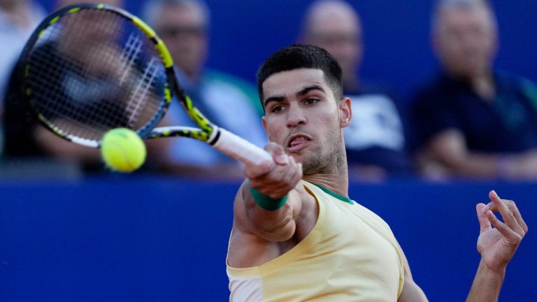 Carlos Alcaraz, of Spain, returns the ball to Argentina's Camilo Carabelli, during an Argentina Open ATP tennis match in Buenos Aires, Argentina, Thursday, Feb. 15, 2024. (Natacha Pisarenko/AP)