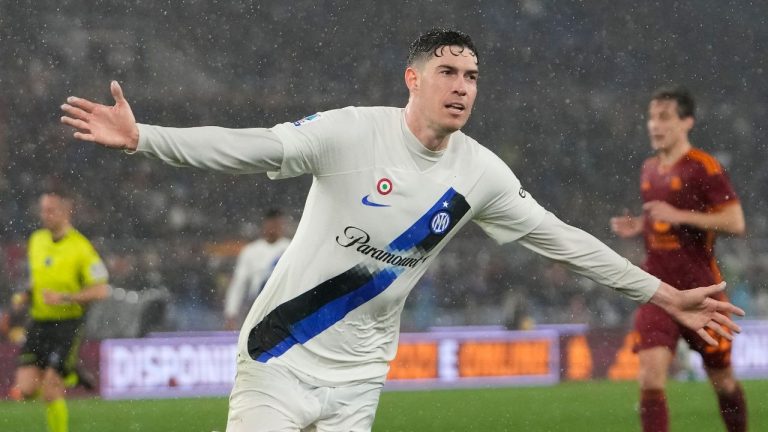 Inter Milan's Alessandro Bastoni celebrates after scoring the fourth goal against Roma during the Italian Serie A soccer match between Roma and Inter Milan at Rome's Olympic stadium, Saturday, Feb. 10, 2024. (Alessandra Tarantino/AP Photo)