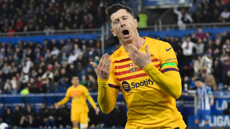 Barcelona's Robert Lewandowski celebrates after scoring his side's opening goal during the La Liga soccer match between Deportivo Alaves and FC Barcelona at the Medizorrosa stadium in Vitoria, Spain, Saturday, Feb. 3, 2024. (Alvaro Barrientos/AP)