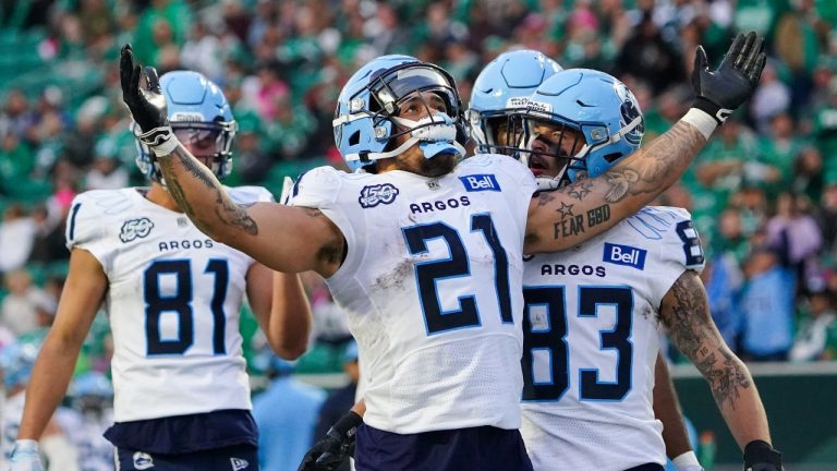 Toronto Argonauts running back Daniel Adeboboye (21) celebrates with teammates after scoring a touchdown against Saskatchewan Roughriders during the second half of CFL football action in Regina, Saturday, Oct. 21, 2023. (CP)