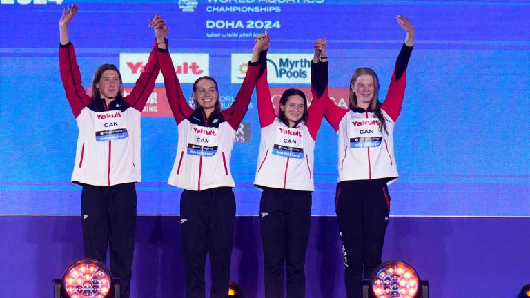Team Canada stand on the podium after winning the bronze medal in the Women's 4x100m Medley Relay final at the World Aquatics Championships in Doha, Qatar, Sunday, Feb. 18, 2024. (Hassan Ammar/AP)