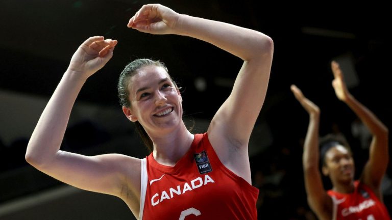 Bridget Carleton of Canada celebrates after her team won the women's basketball Olympic qualifying tournament first round match between Hungary and Canada in Sopron, Hungary, Thursday, Feb. 8, 2024. (Zsombor Toth/MTI via AP)