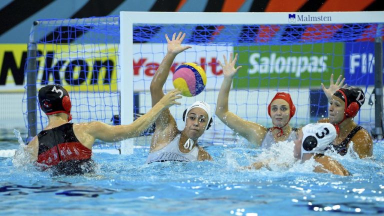The Canadian women's water polo team qualified for the 2024 Paris Olympics after South Africa forfeited its allocated spot. Axelle Crevier of Canada, left, in action during the women's water polo match of New Zealand vs Canada played for the 9th place at the 19th FINA World Aquatics Championships in Szeged, Hungary, Thursday, June 30, 2022. (CP/AP-MTI, Zsolt Czegledi)