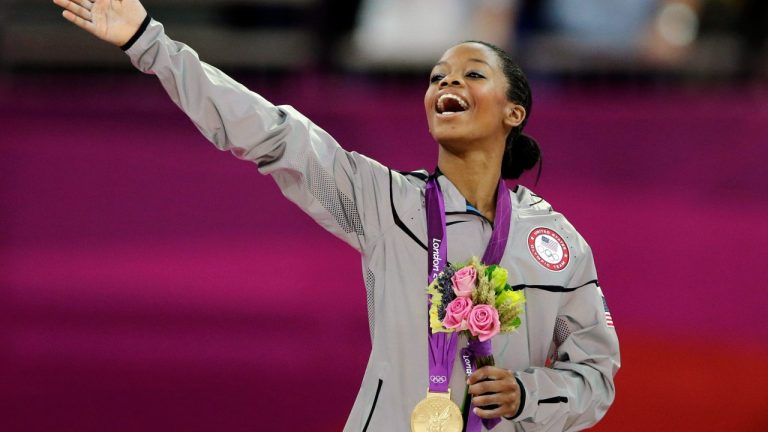 Gabrielle Douglas, of the United States, acknowledges the crowd after receiving her gold medal in the artistic gymnastics women's individual all-around competition at the 2012 Summer Olympics in London. (Gregory Bull/AP)