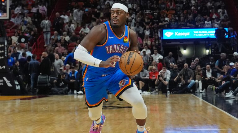 Oklahoma City Thunder guard Luguentz Dort (5) dribbles the ball during the first half of an NBA basketball game against the Miami Heat, Wednesday, Jan. 10, 2024, in Miami. (Marta Lavandier/AP)