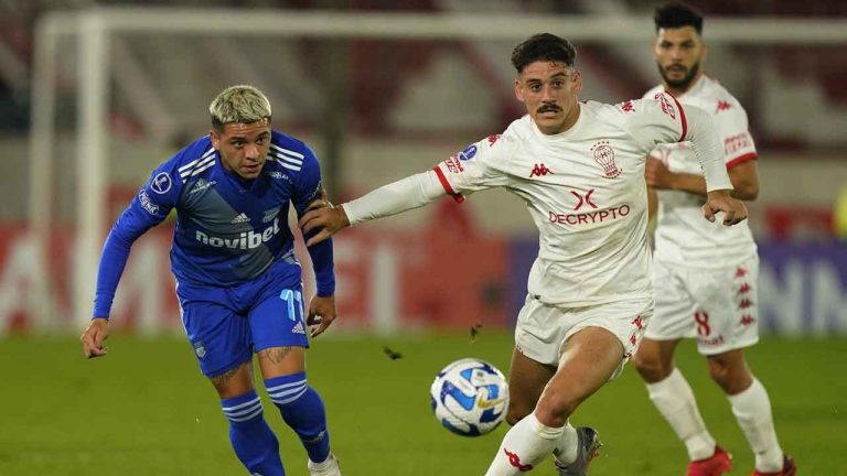 Matias Coccaro of Argentina's Huracan, right, and Diego Garcia of Ecuador's Emelec battle for the ball during a Copa Sudamericana Group B soccer match at Tomas Adolfo Duco stadium. (Ivan Fernandez/AP)
