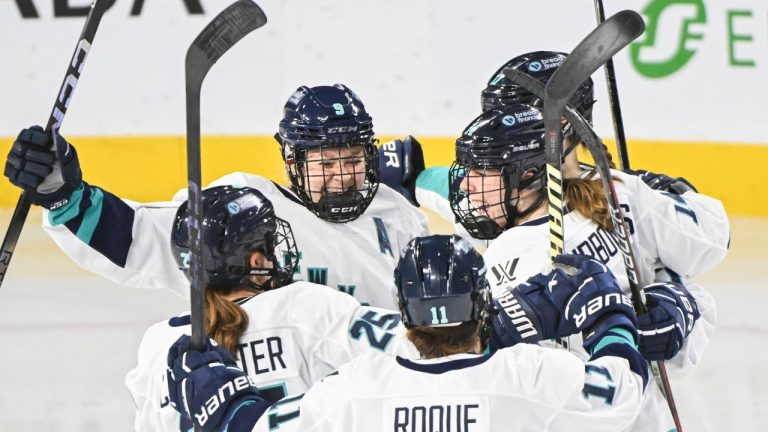 New York players swarm teammate Jaime Bourbonnais during second period PWHL hockey action against Montreal in Laval, Que., Tuesday, January 16, 2024. (Graham Hughes/CP Photo)