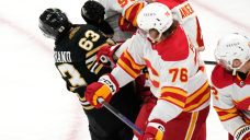 Flames’ Pospisil receives game misconduct for cross-checking Bruins’ Marchand