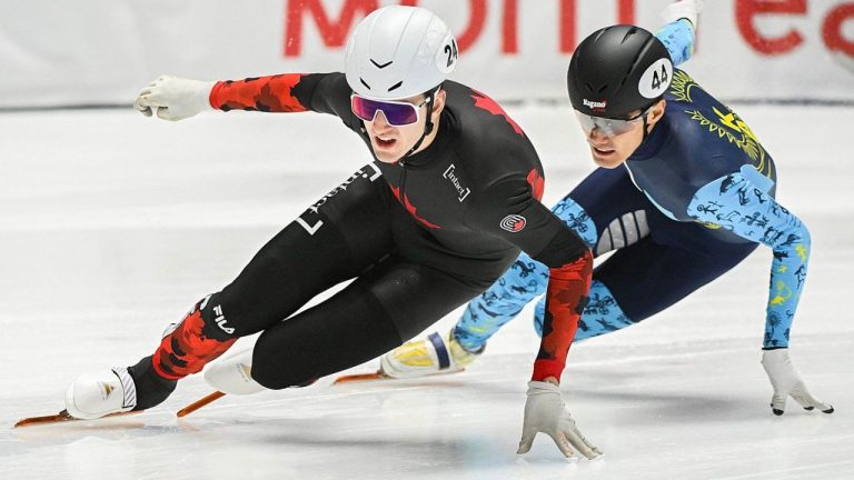 Roussel skates ahead of Yerkebulan Shamukhanov of Kazakhstan during the 1500-metre repechage semifinal race at the World Cup short track speedskating event in Montreal, Saturday, October 28, 2023. (Graham Hughes/CP Photo)
