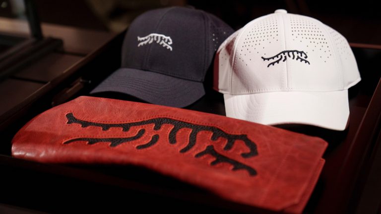 Merchandise from a new clothing line by Tiger Woods, called Sun Day Red, is displayed during a news conference ahead of the Genesis Open golf tournament, Monday, Feb. 12, 2024, in the Pacific Palisades area of Los Angeles. (Eric Thayer/AP)