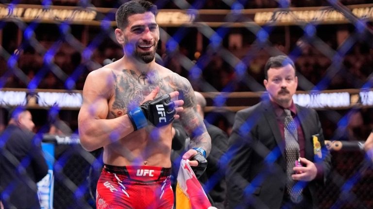 Ilia Topuria celebrates after knocking out Alexander Volanovski during their featherweight bout at the UFC 298 mixed martial arts event Saturday, Feb. 17, 2024, in Anaheim, Calif. (