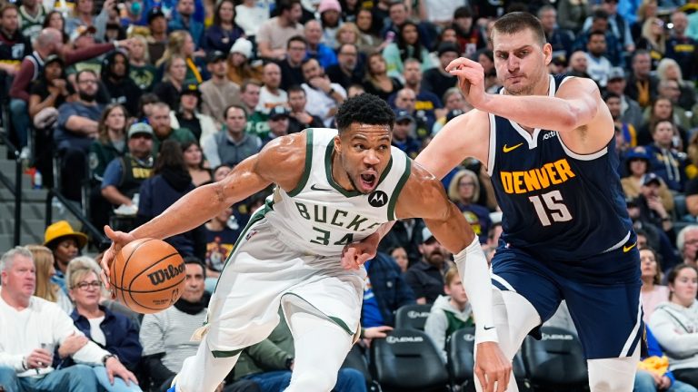 Milwaukee Bucks forward Giannis Antetokounmpo (34) drives past Denver Nuggets center Nikola Jokic (15) in the second half of an NBA basketball game Monday, Jan. 29, 2024, in Denver. (David Zalubowski/AP)