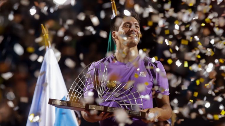 Sebastian Baez holds his trophy after defeating Mariano Navone, both of Argentina, during the final match of the Rio Open tennis tournament in Rio de Janeiro, Brazil, Sunday, Feb. 25, 2024. (Bruna Prado/AP)