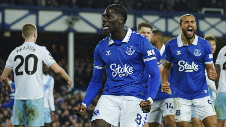 Everton's Amadou Onana, front, celebrates after scoring his side's first goal during the English Premier League soccer match between Everton and Crystal Palace at the Goodison Park stadium, in Liverpool, England, Monday, Feb. 19, 2024. (Peter Byrne/PA via AP)