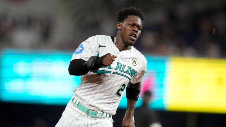 Miami Marlins' Jazz Chisholm Jr. runs home to score on a double hit by Garrett Hampson during the seventh inning of a baseball game against the Atlanta Braves, Friday, Sept. 15, 2023, in Miami. (Lynne Sladky/AP)
