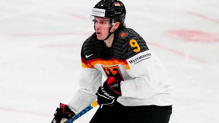 Germany's Leon Gawanke controls the puck during the group A match between Austria and Germany at the ice hockey world championship in Tampere, Finland, Friday, May 19, 2023. (Pavel Golovkin/AP)