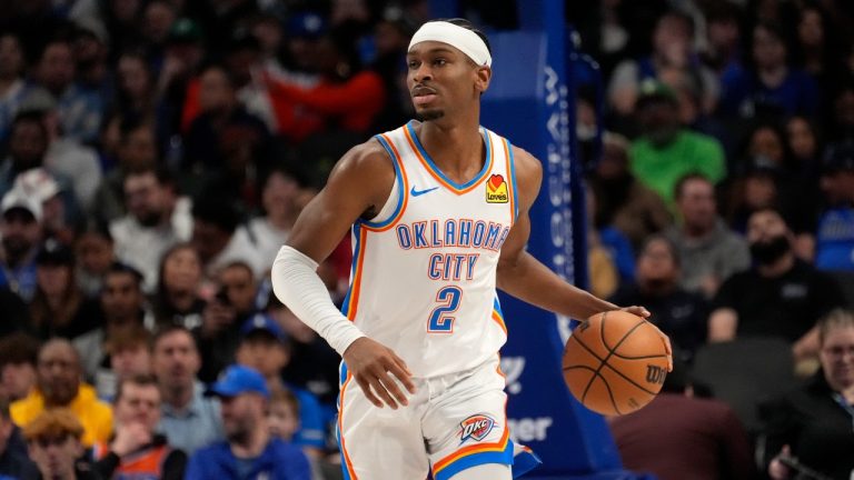 Oklahoma City Thunder guard Shai Gilgeous-Alexander handles the ball during an NBA basketball game against the Dallas Mavericks in Dallas, Saturday, Feb. 10, 2024. (Tony Gutierrez/AP)