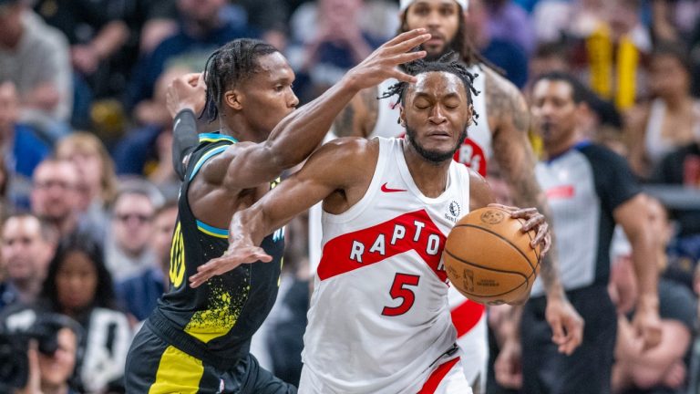 Toronto Raptors guard Immanuel Quickley (5) reacts as Indiana Pacers guard Bennedict Mathurin, left, makes contact with him while bringing the ball upcourt after a turnover during the second half of an NBA basketball game in Indianapolis, Monday, Feb. 26, 2024. (Doug McSchooler/AP Photo)