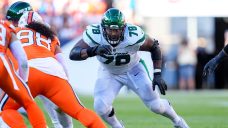 AP source: Jets releasing durable guard Laken Tomlinson