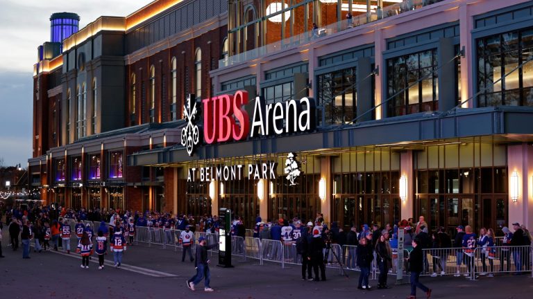 Fans wait to enter the new UBS Arena for the first New York Islanders NHL hockey game against the Calgary Flames, Saturday, Nov. 20, 2021, in Elmont, N.Y. (Adam Hunger/AP)