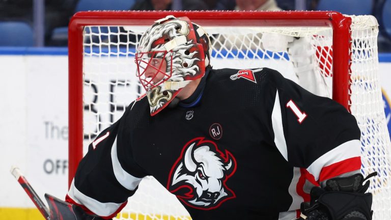 Buffalo Sabres goaltender Ukko-Pekka Luukkonen (1)looks for the puck during the second period of an NHL hockey game against the Los Angeles Kings Tuesday, Feb. 13, 2024, in Buffalo, N.Y. (Jeffrey T. Barnes/AP Photo)