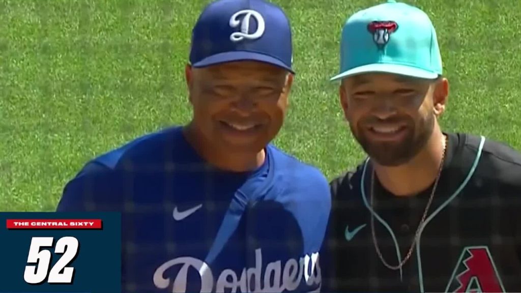Dave Roberts and son Cole exchange lineup cards before sharing the field