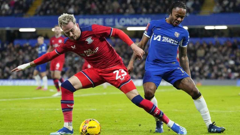 Preston's Liam Millar, left, and Chelsea's Raheem Sterling vie for the ball during the English FA Cup soccer match between Chelsea and Preston North End at Stamford Bridge stadium in London, Saturday, Jan. 6, 2024. (Kirsty Wigglesworth/AP)