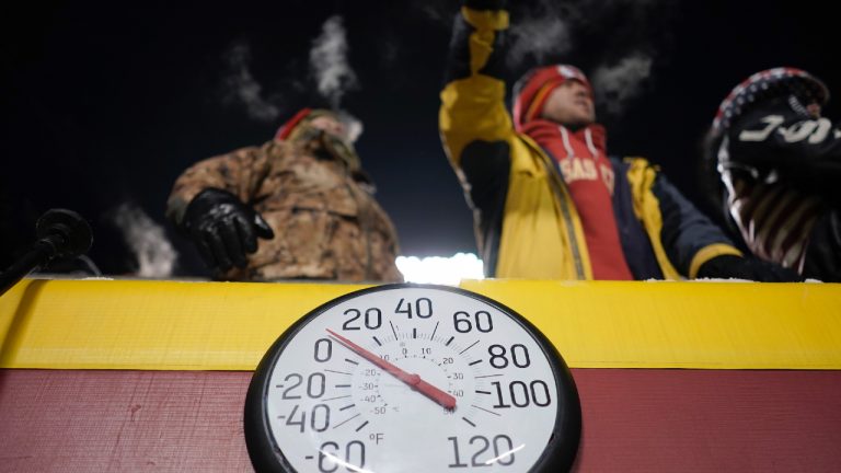 Fans watch behind the temperature being displayed on the field at Arrowhead Stadium during the first half of an NFL wild-card playoff football game between the Kansas City Chiefs and the Miami Dolphins Saturday, Jan. 13, 2024, in Kansas City, Mo. (Charlie Riedel/AP)