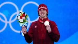 Canada's Mark McMorris displays his bronze medal during the medal ceremony for men's snowboard slopestyle at the Beijing Winter Olympics in Zhangjiakou, China, on Monday, Feb. 7, 2022. (Sean Kilpatrick/CP)