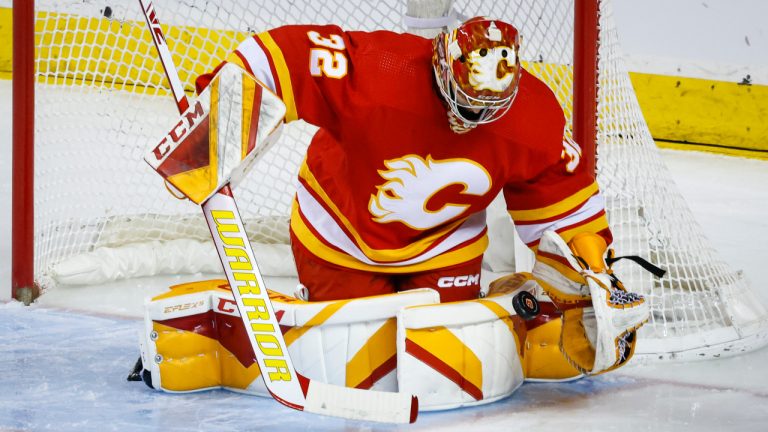 Calgary Flames goalie Dustin Wolf makes a save during first period NHL hockey action against the San Jose Sharks in Calgary, Wednesday, April 12, 2023.THE CANADIAN PRESS/Jeff McIntosh 
