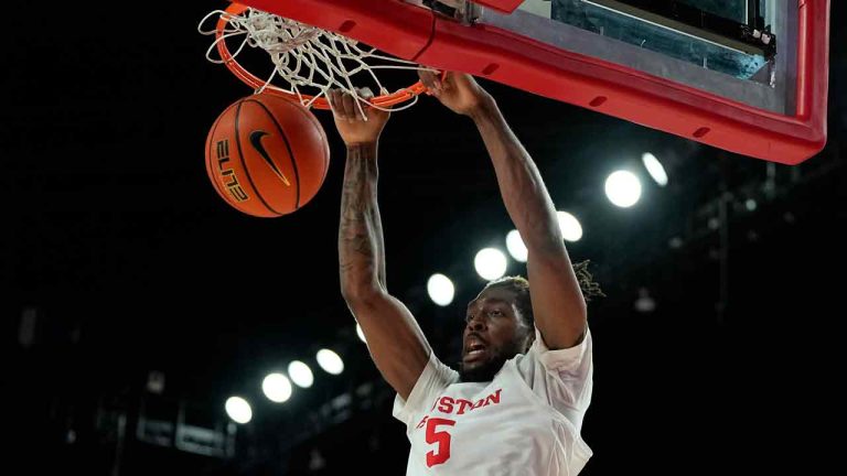 Houston forward Ja'Vier Francis dunks the ball during the second half of an NCAA college basketball game against Jackson State, Saturday, Dec. 9, 2023, in Houston. (Kevin M. Cox/AP)