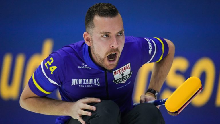Brendan Bottcher calls out to the sweepers after delivering a rock while playing Newfoundland and Labrador during the Brier, in Regina, on Saturday, March 2, 2024. (Darryl Dyck/CP)