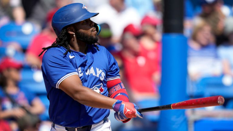 Toronto Blue Jays' Vladimir Guerrero Jr. watches his home run in the first inning of a spring training baseball game against the Philadelphia Phillies Monday, March 4, 2024, in Dunedin, Fla. (AP Photo/Charlie Neibergall) 