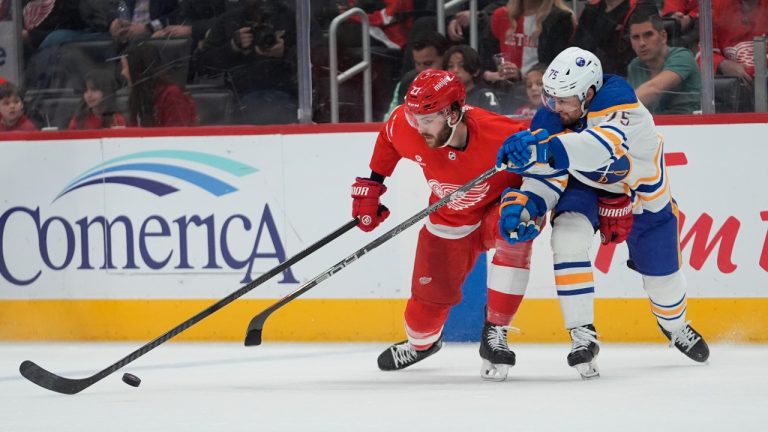 Detroit Red Wings center Michael Rasmussen (27) and Buffalo Sabres defenseman Connor Clifton (75) battle for the puck in the first period of an NHL hockey game Saturday, March 16, 2024, in Detroit. (AP)