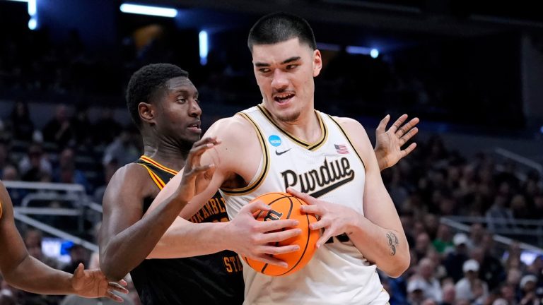 Purdue centre Zach Edey drives around Grambling State forward Malik Lamin, left, in the second half of a first-round college basketball game in the NCAA Tournament, Friday, March 22, 2024, in Indianapolis. (Michael Conroy/AP) 