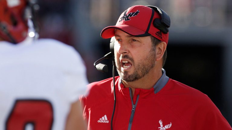 Eastern Washington head coach Beau Baldwin speaks with his team during a timeout during the first half of an NCAA college football game against the Washington State in Pullman, Wash., Saturday, Sept. 3, 2016. (Young Kwak/AP) 