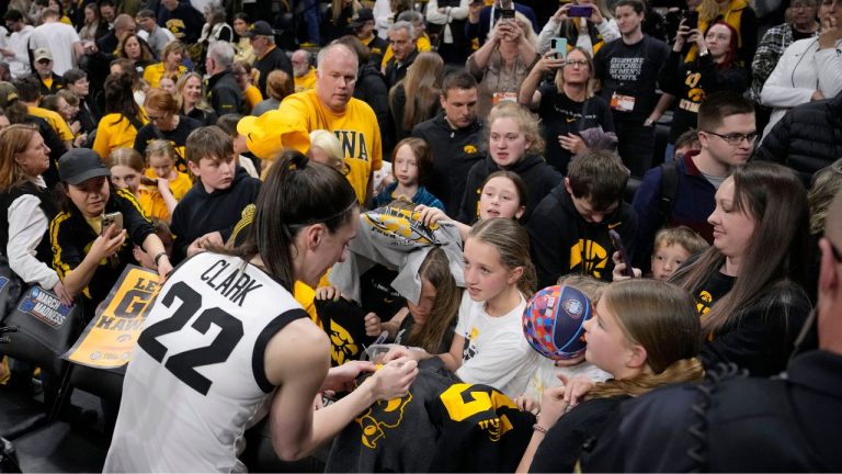 Iowa guard Caitlin Clark signs autographs for fans following their 91-65 victory over Holy Cross in a first-round college basketball game in the NCAA Tournament, Saturday, March 23, 2024, in Iowa City, Iowa. (Matthew Putney/AP Photo)