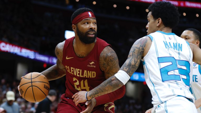 Cleveland Cavaliers forward Marcus Morris Sr. (24) drives against Charlotte Hornets guard Tre Mann (23) during the first half of an NBA basketball game, Monday, March 25, 2024, in Cleveland. (Ron Schwane/AP)
