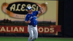 Toronto Blue Jays second baseman Davis Schneider drops a fly ball hit by New York Yankees' Austin Wells during the second inning of a spring training baseball game Friday, March 1, 2024, in Tampa, Fla. (Charlie Neibergall/AP Photo)