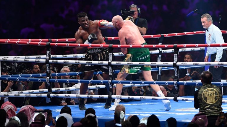 Tyson Fury, of England, the WBC and lineal heavyweight champion, center right, fights former UFC heavyweight champion Francis Ngannou, of Cameroon, during their boxing match to mark the start of Riyadh Season at Kingdom Arena stadium in Riyadh, Saudi Arabia, Sunday, Oct. 29, 2023. (Yazeed Aldhawaihi/AP)