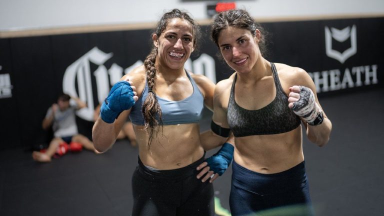 Sisters Ana (left) and Lupita "Loopy" Godinez are shown during a workout in Las Vegas in a March 18, 2024, handout photo. Ana has qualified to represent Canada in wrestling at the Paris Olympics this summer. Older sister Lupita has won her last four fights at strawweight in the UFC. (CP/HO-UFCEspanol, Juan Cardenas)