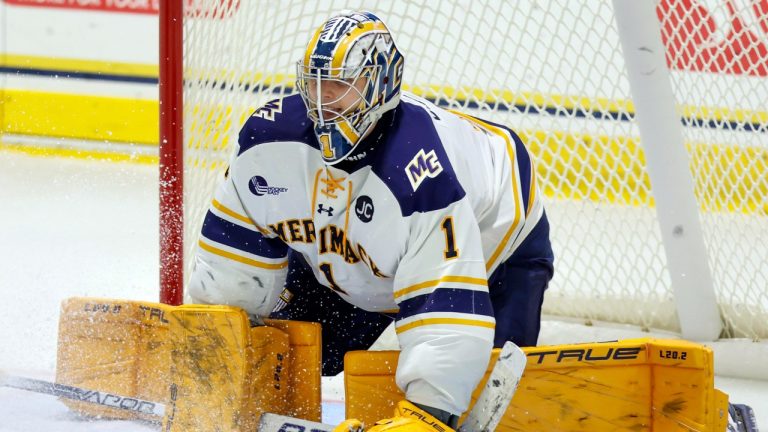 FILE - Merrimack College goalie Hugo Ollas (1) covers up the puck during the third period of an NCAA hockey game against Massachusetts on Saturday, Oct. 29, 2022. (Greg M. Cooper/AP)
