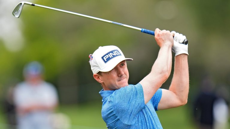 Mackenzie Hughes, of Canada, watches his tee shot on the eighth hole during the second round of the Valspar Championship golf tournament Friday, March 22, 2024, at Innisbrook in Palm Harbor, Fla. (AP Photo/Chris O'Meara)