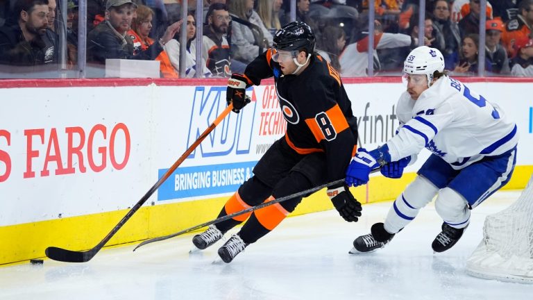 Philadelphia Flyers' Cam York, left, tries to keep Toronto Maple Leafs' Tyler Bertuzzi away from the puck during the first period of an NHL hockey game, Tuesday, March 19, 2024, in Philadelphia. (Matt Slocum/AP)
