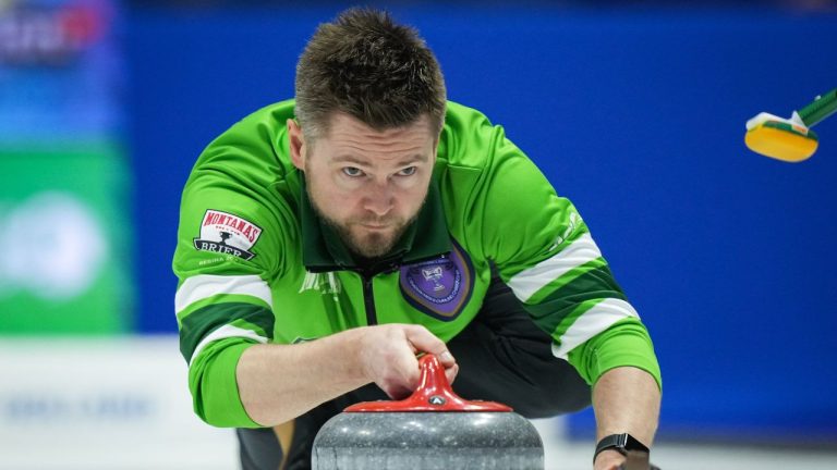 Saskatchewan skip Mike McEwen delivers a rock while playing Team Alberta-Bottcher during the semifinal at the Brier, in Regina, on Sunday, March 10, 2024. (Darryl Dyck/CP)