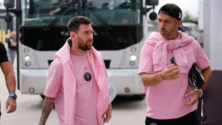 Inter Miami forwards Lionel Messi and Luis Suarez talk together as they arrive ahead of an MLS soccer match against Orlando City, Saturday, March 2, 2024, in Fort Lauderdale, Fla. (Rebecca Blackwell/AP Photo)