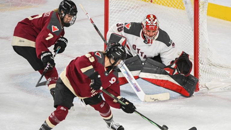 Montreal's Laura Stacey (7) and Kristin O'Neill (43) move in on Ottawa goaltender Emerance Maschmeyer during second period PWHL hockey action in Laval, Que., Sunday, March 10, 2024. (Graham Hughes/CP)