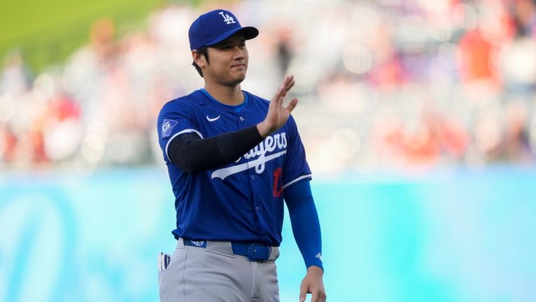 Los Angeles Dodgers designated hitter Shohei Ohtani warms up before an exhibition baseball game against the Los Angeles Angels, Tuesday, March 26, 2024, in Anaheim, Calif. (Ryan Sun/AP Photo)