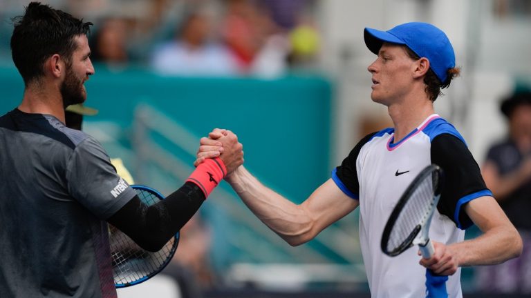 Jannik Sinner, of Italy, right, clasps hands with Andrea Vavassori, of Italy, after Sinner won their men's second round match at the Miami Open tennis tournament, Saturday, March 23, 2024, in Miami Gardens, Fla. (Rebecca Blackwell/AP)